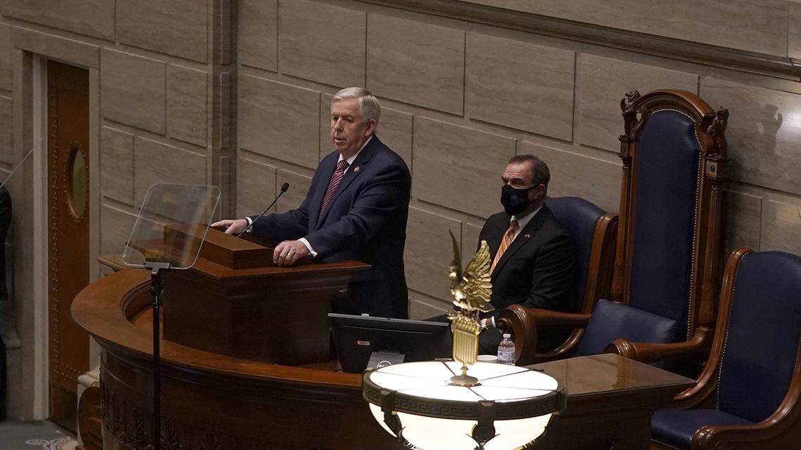 Missouri Gov. Mike Parson delivers the state of the state address Wednesday, Jan. 27, 2021, in the Missouri Senate chamber. He opposed Medicaid expansion but after it passed on a statewide ballot, said he would include money for it in the state budget.