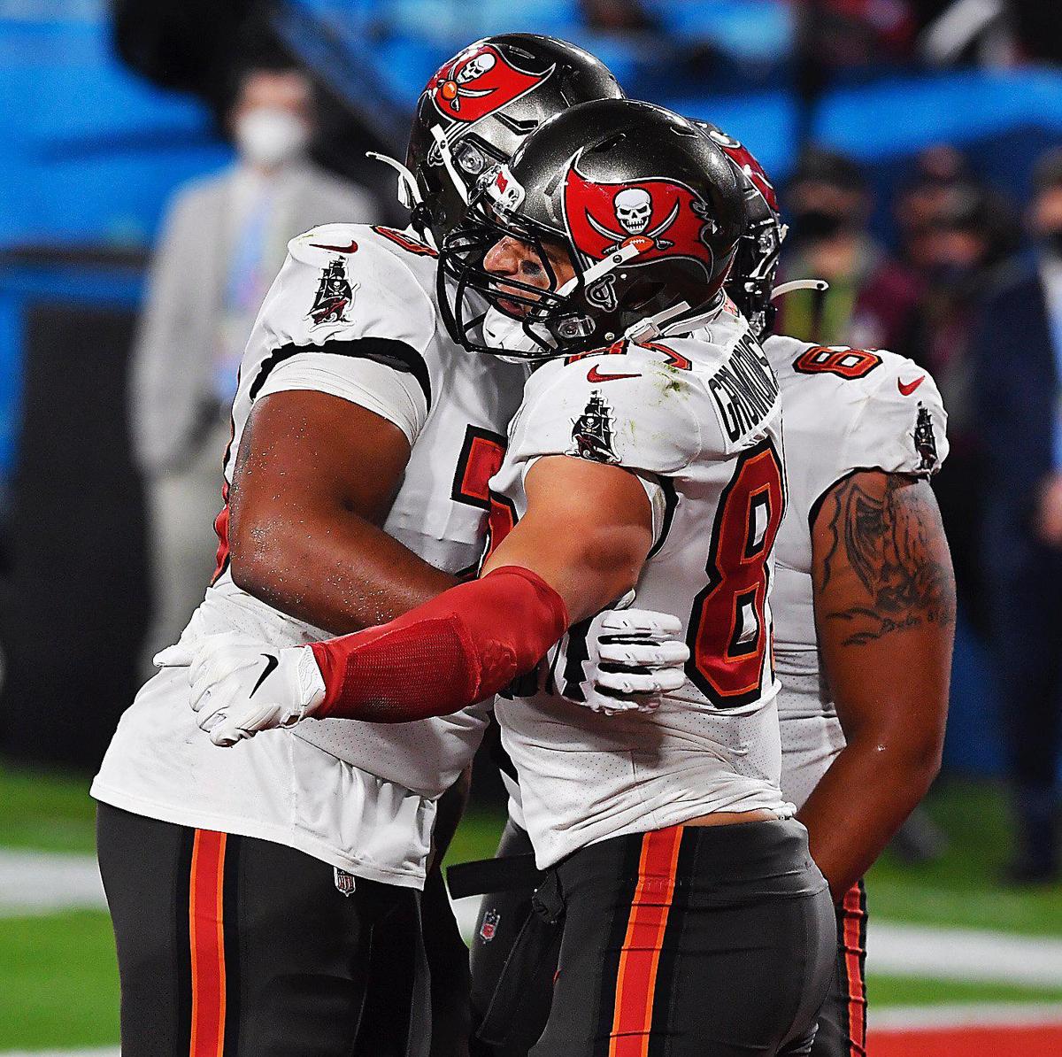 Tampa Bay Buccaneers teammates congratulate tight end Rob Gronkowski after he pulled in a pass for a touchdown in the second quarter against the Kansas City Chiefs Sunday, February 7, 2021, at Super Bowl LV at Raymond James Stadium in Tampa, Florida.
