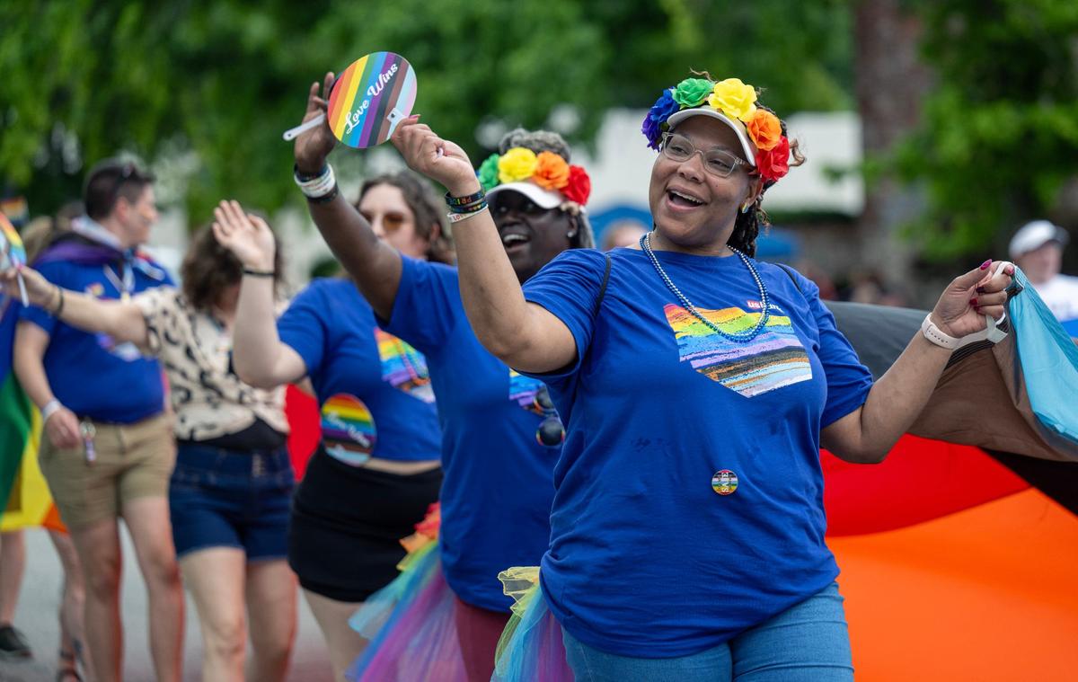 Parade participants from U.S. Bank waved to the crowd during the KC Pride Parade on Saturday, June 8, 2024, in Kansas City.