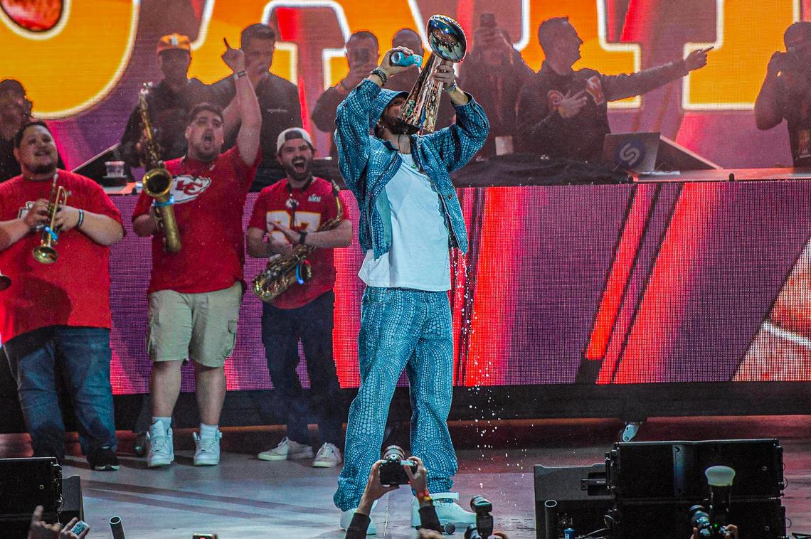 Travis Kelce pours seltzer down a Vince Lombardi Trophy replica during Kelce Jam at the Azura Amphitheater on Friday, April 28, 2023, in Bonner Springs.