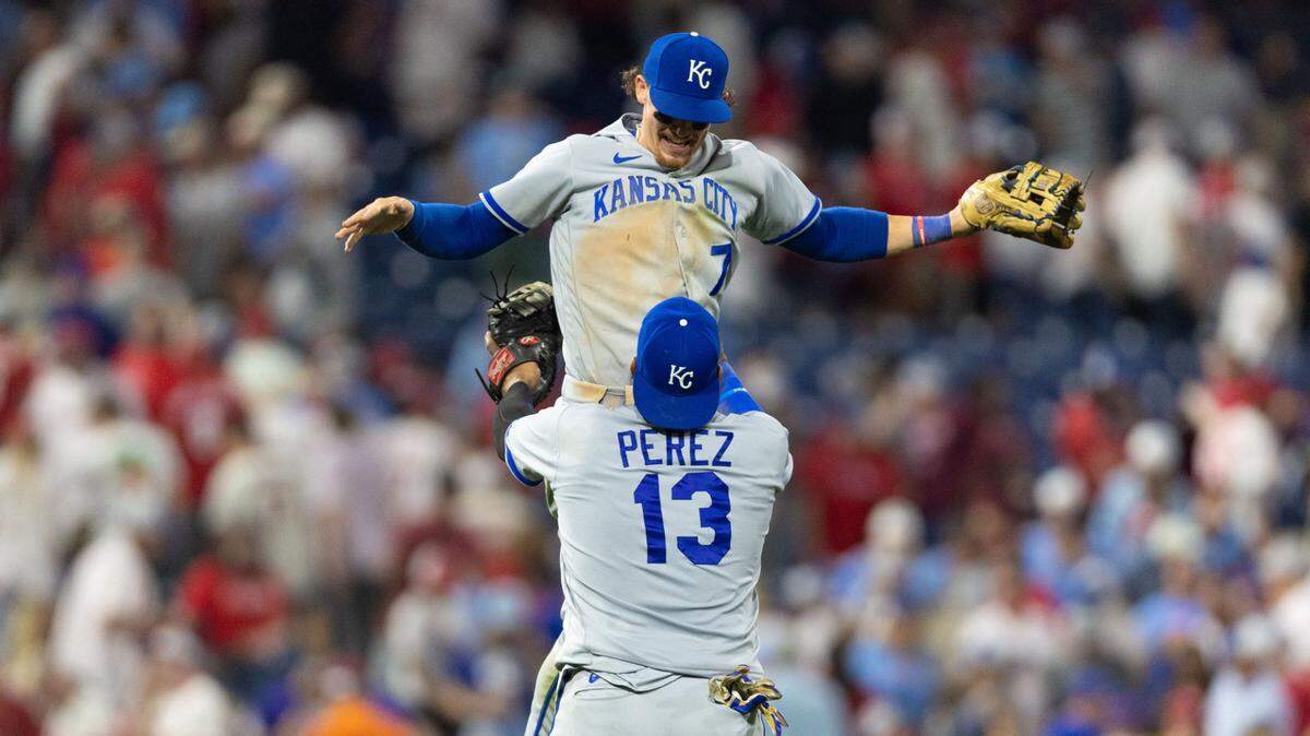 Kansas City Royals catcher Salvador Perez (13) lifts shortstop Bobby Witt Jr. (7) as they celebrate a victory against the Philadelphia Phillies at Citizens Bank Park on Aug. 4, 2023.