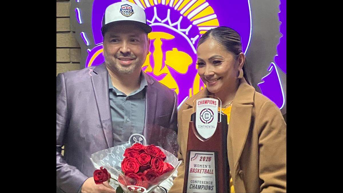Haskell women’s basketball coach Adam Strom poses with his wife, Relyn, after leading his team to an NAIA Tournament-clinching victory on Sunday, March 2, 2025 in Lawrence, Kansas.