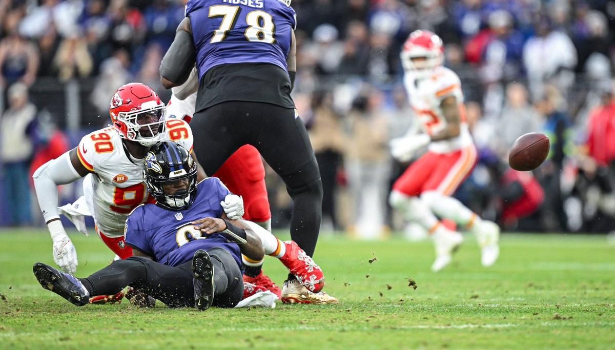 Kansas City Chiefs defensive end Charles Omenihu (90) forces Baltimore Ravens quarterback Lamar Jackson (8) to fumble in the second quarter Sunday, Jan. 28, 2024, during the AFC Championship Game in Baltimore.