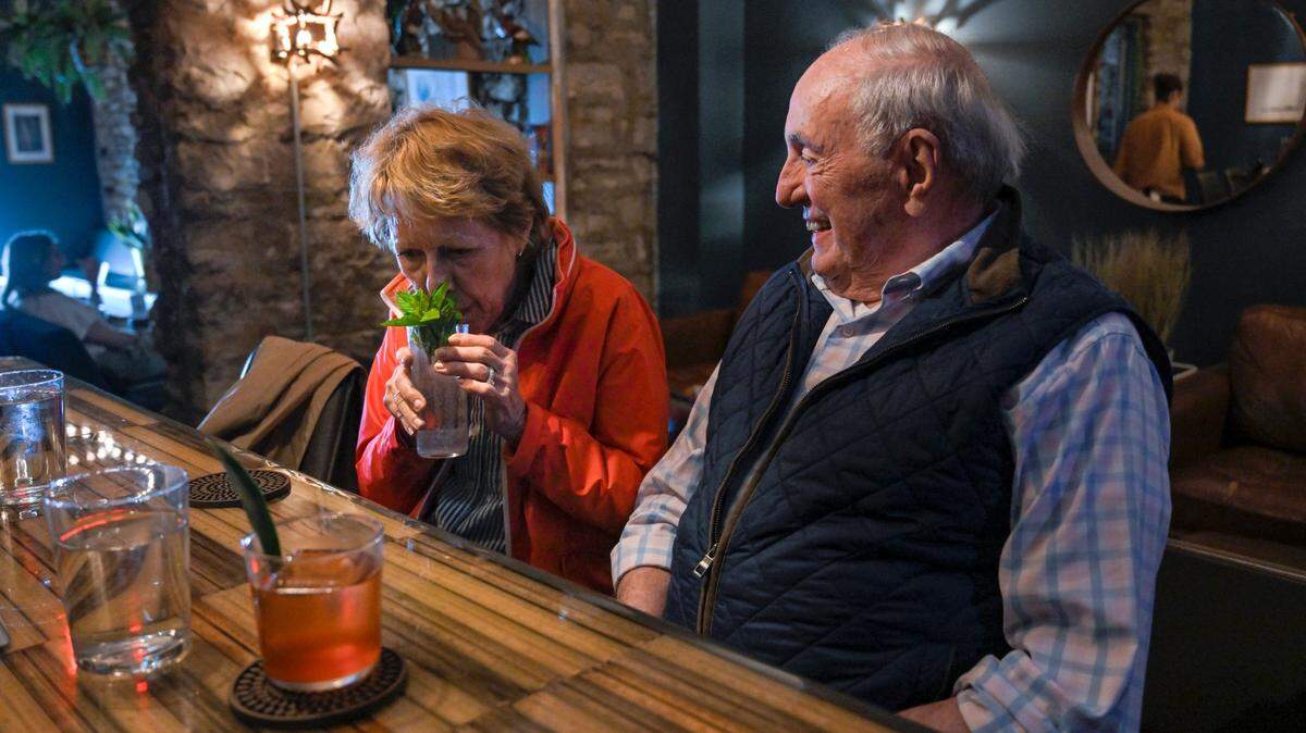 Susan Masson takes a whiff of her cocktail garnish as husband Alex Masson looks on from one of six seats at Drastic Measures’ small bar. Drastic Measures is a James Beard Award semifinalist for Outstanding Bar.