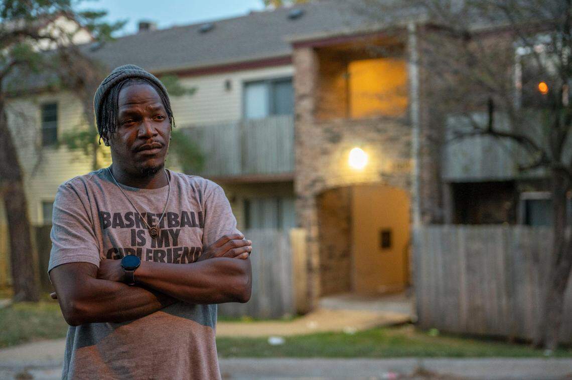 Khatib Williams stands in front of his previous apartment complex on Thursday, Sep. 29, 2022, in Kansas City. 