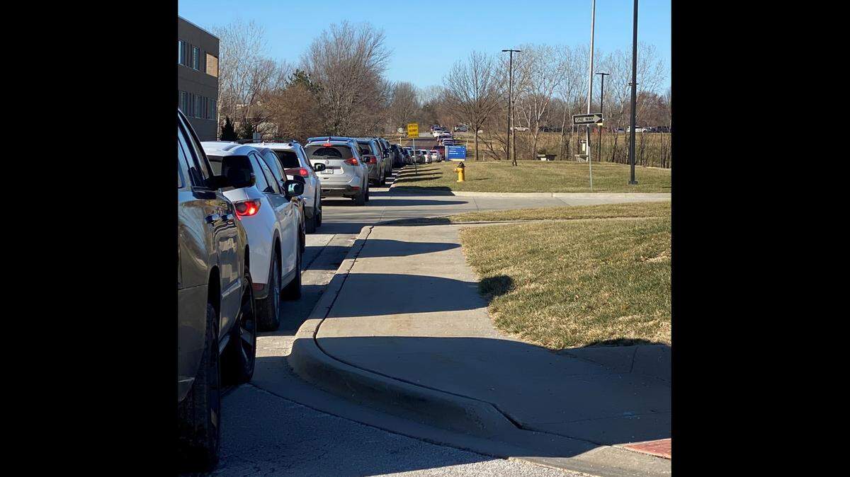Katherine Houlehan, a parent in the Blue Valley School District, waited in line for 90 minutes so her children could receive a COVID-19 test on Sunday, Jan. 9, 2022, at the MAWD drive-in testing clinic at 14950 Newton Drive in Overland Park, Kansas. Houlehan took a photo of the line at about 10:30 a.m.