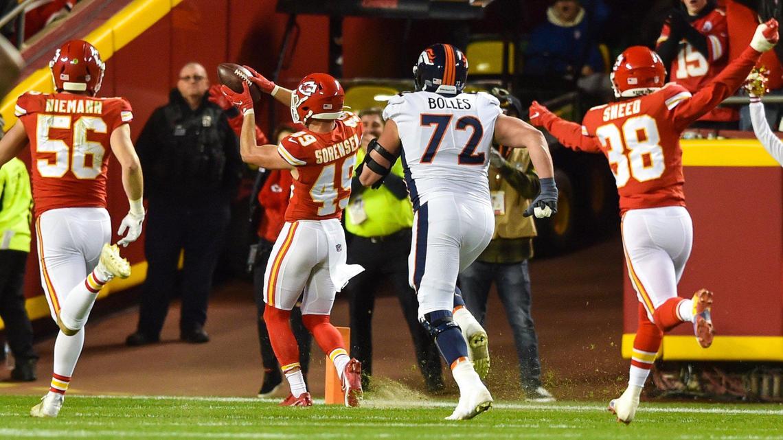 Kansas City Chiefs safety Daniel Sorensen held the ball up in celebration as he headed for the end zone after intercepting a pass thrown by Denver Broncos quarterback Teddy Bridgewater in the fourth quarter Sunday, December 5, 2021, at Arrowhead Stadium.