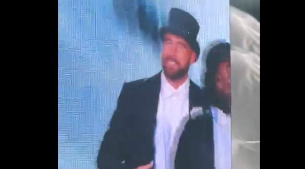 Travis Kelce on stage at the Eras Tour show in London.