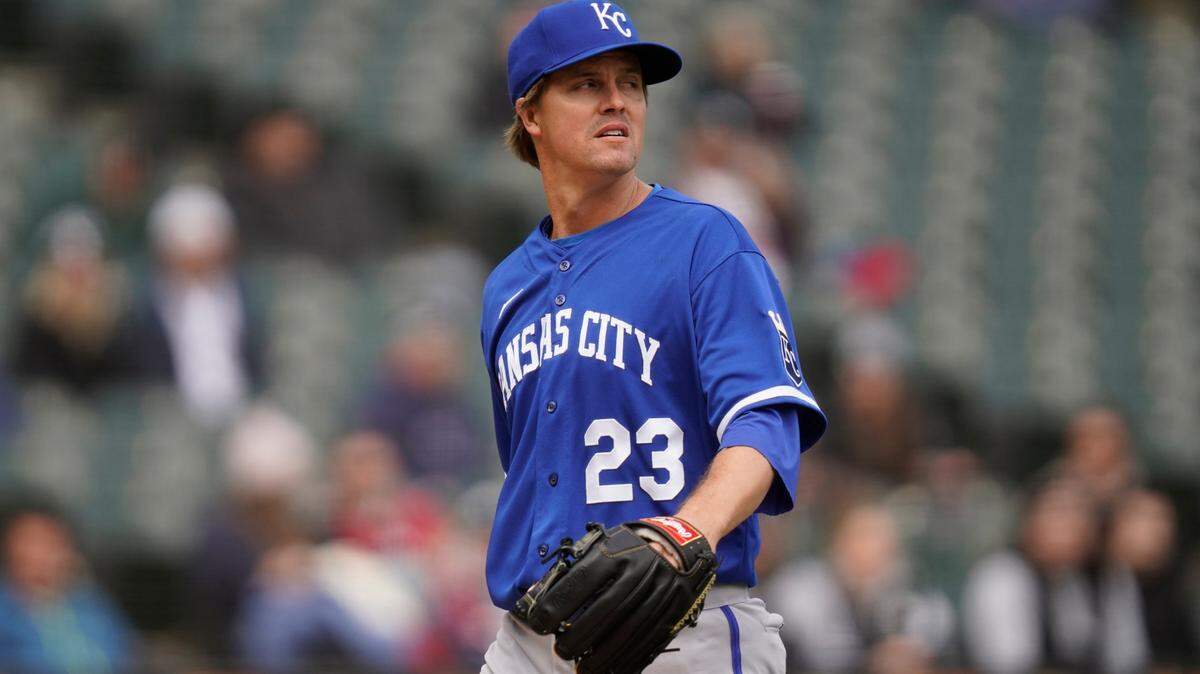 Kansas City Royals starting pitcher Zack Greinke looks at the scoreboard as he heads back to the dugout in a baseball game against the Chicago White Sox Wednesday, April 27, 2022, in Chicago. (AP Photo/Charles Rex Arbogast)
