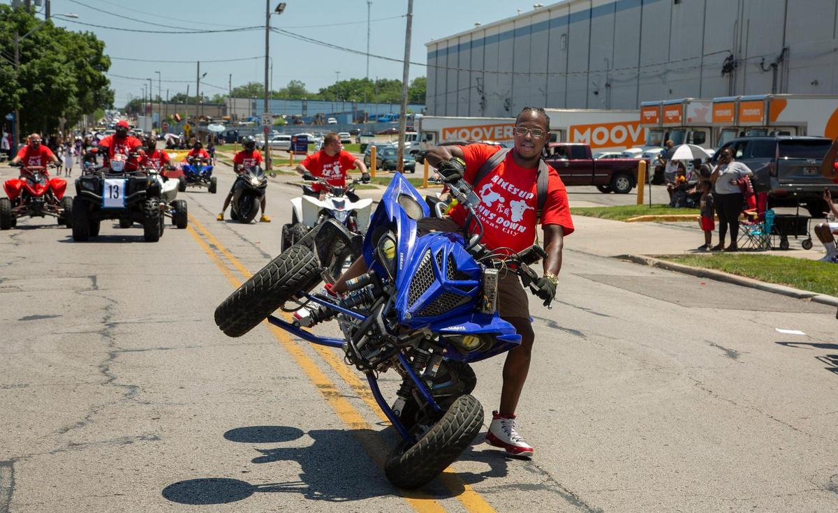 Riders with Bikes Up Guns Down rode past the judges stand at the JuneteenthKC 2021 Cultural Parade Saturday, June 12, 2021 in the Historic Jazz District near 18th and Vine.