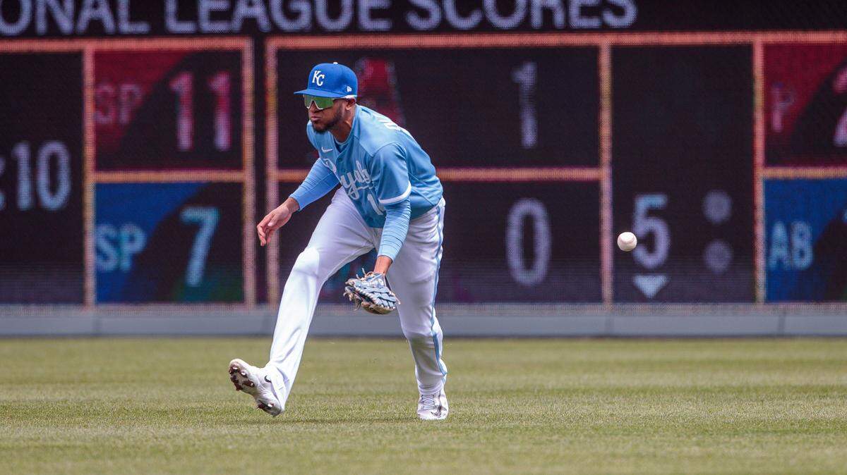 Apr 16, 2023; Kansas City, Missouri, USA; Kansas City Royals left fielder Edward Olivares (14) misses a ground ball during the third inning against the Atlanta Braves at Kauffman Stadium. Mandatory Credit: William Purnell-USA TODAY Sports