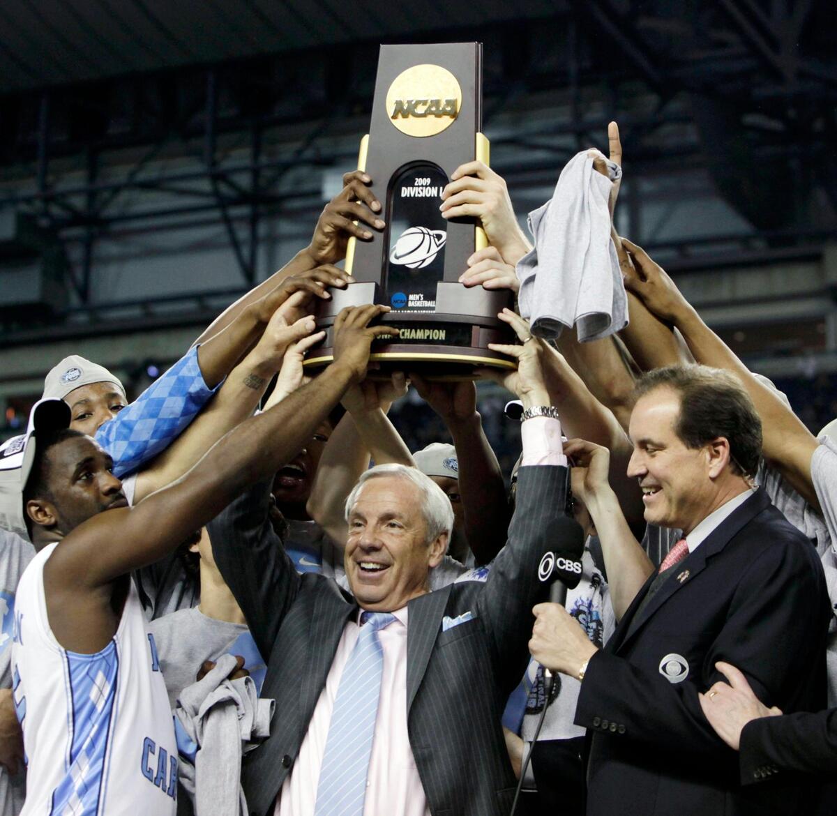 Roy Williams celebrates with his team after their 89-72 victory over Michigan State in the championship game at the men’s NCAA Final Four college basketball tournament in Detroit April 7, 2009,