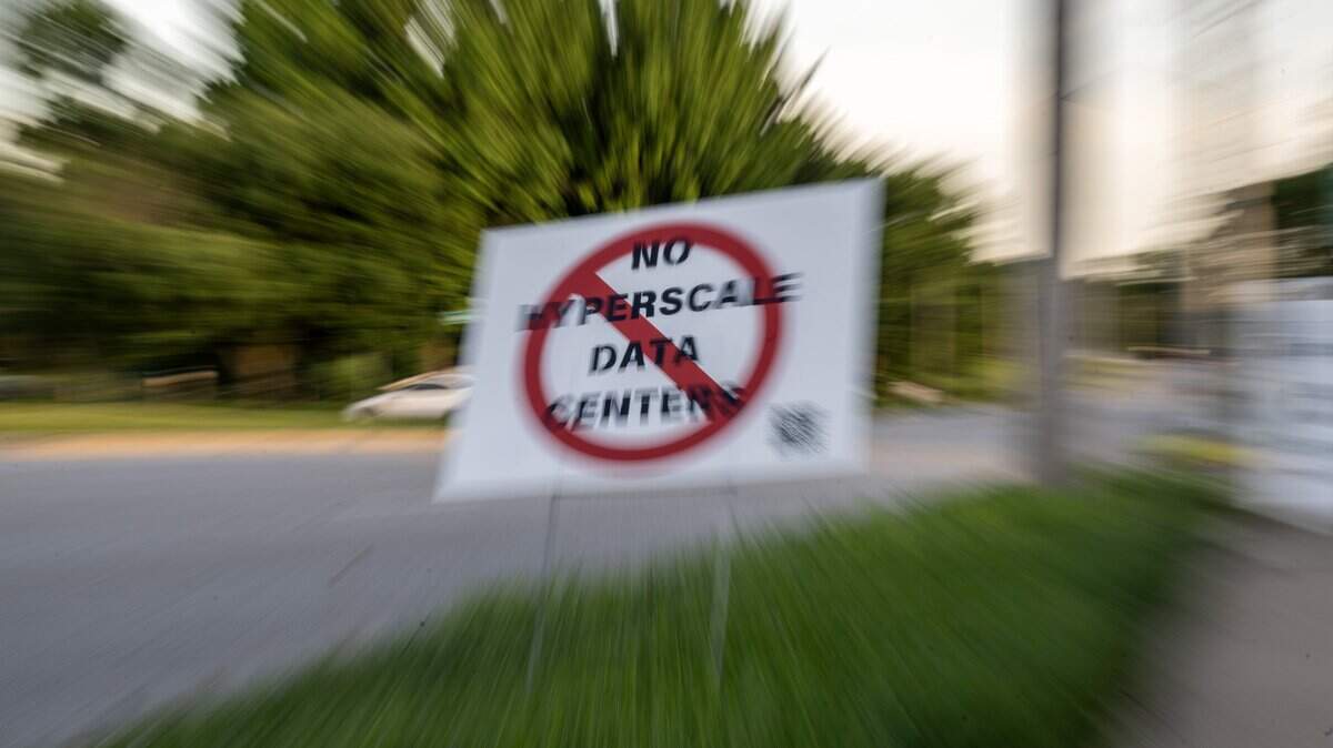 A "No Data Center" sign is displayed outside a town hall meeting at The Rhapsody on Tuesday, June 2, 2026, in Independence. Community members gathered to discuss opposition to the proposed Nebius data center project.