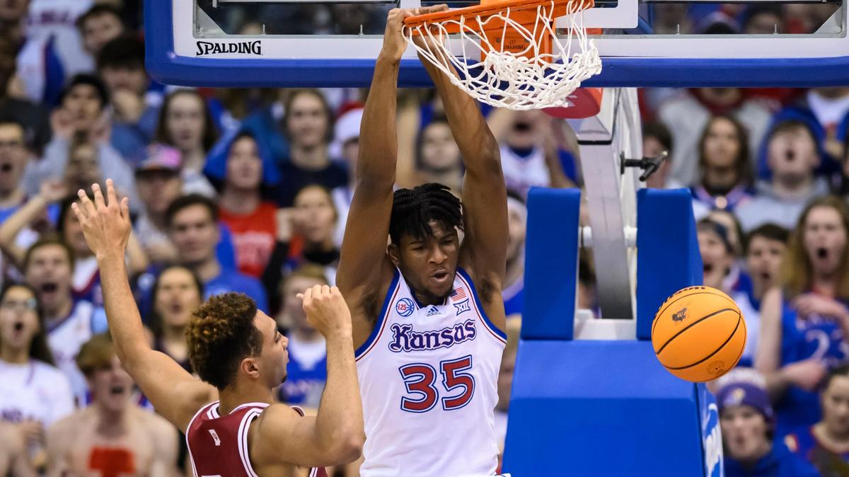 Kansas forward Zuby Ejiofor throws down a dunk in front of Indiana forward Trayce Jackson-Davis during a game at Allen Fieldhouse.