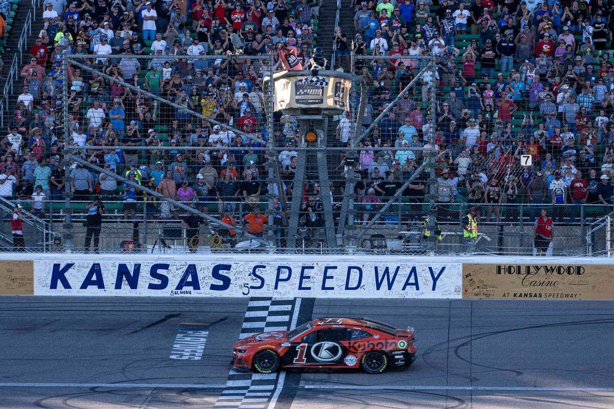 NASCAR Cup Series driver Ross Chastain crosses the finish line to win the Hollywood Casino 400 at Kansas Speedway.