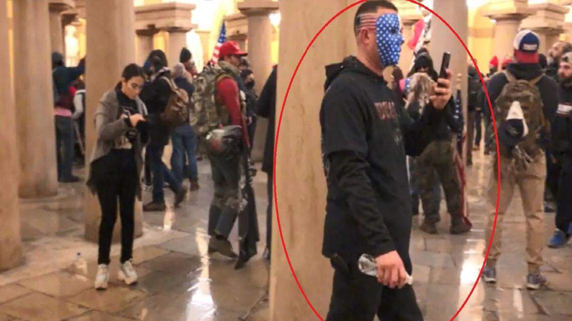 Prosecutors say Chad Suenram wore a face mask painted with an American flag and had an American flag painted on the right side of his head when he entered the Capitol on Jan. 6, 2021.