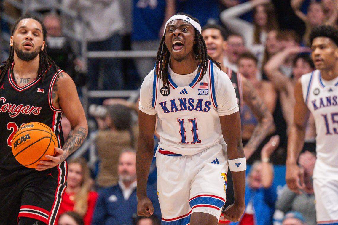 Kansas Jayhawks guard Jamari McDowell (11) yells after forcing a shot clock violation during the first half vs. the Houston Cougars on Monday, February 23, 2026, at Allen Fieldhouse.