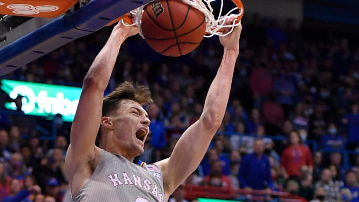 KU’s Christian Braun threw down a monster dunk over Nevada’s Will Baker during the first half of Wednesday night’s game at Allen Fieldhouse.
