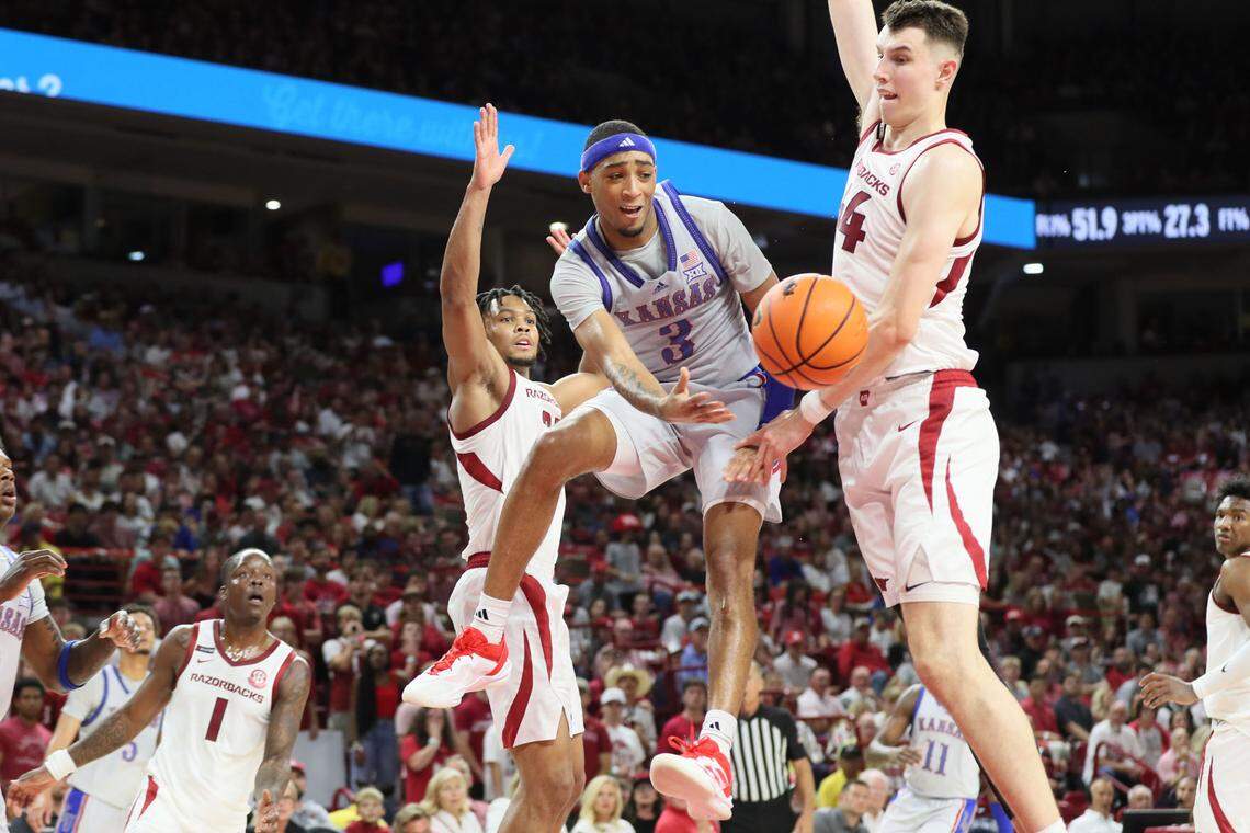 Kansas Jayhawks guard Dajuan Harris Jr. passes the basketball during Friday night’s exhibition game against the Arkansas Razorbacks at Bud Walton Arena in Fayetteville, Ark.