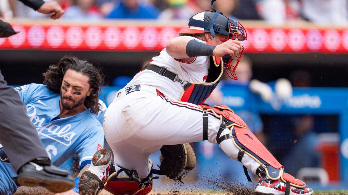 Kansas City Royals second baseman Jonathan India (6) scores as Minnesota Twins catcher Christian Vazquez (8) catches the ball off the dirt in the fifth inning at Target Field on May 24, 2025.