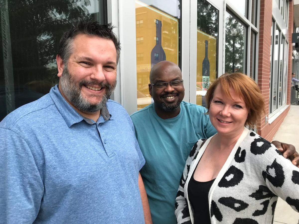 Michael Scherzberg, left, Kyle Ketchum and Megan Downes of Vintage ’78 Wine Bar.