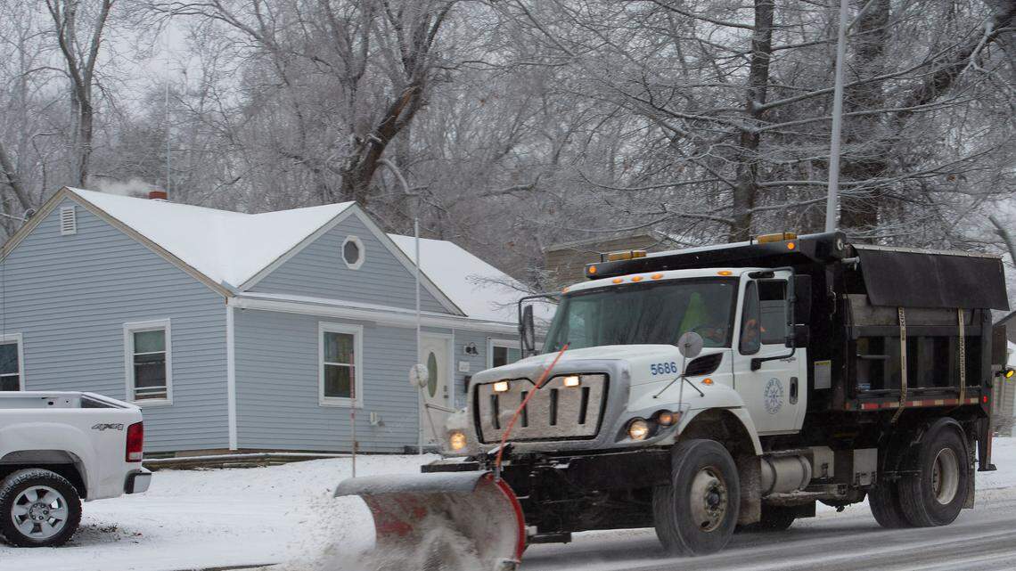 In this February 2021 file photo, a plow truck clears snow and ice from 75th Street in Prairie Village.