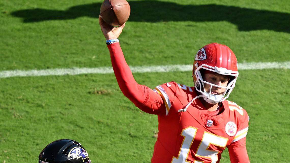 Kansas City Chiefs quarterback Patrick Mahomes (15) throws while being pressured by the Baltimore Ravens defense in the second quarter on Sunday, Sept. 28, 2025, at GEHA Field at Arrowhead Stadium.