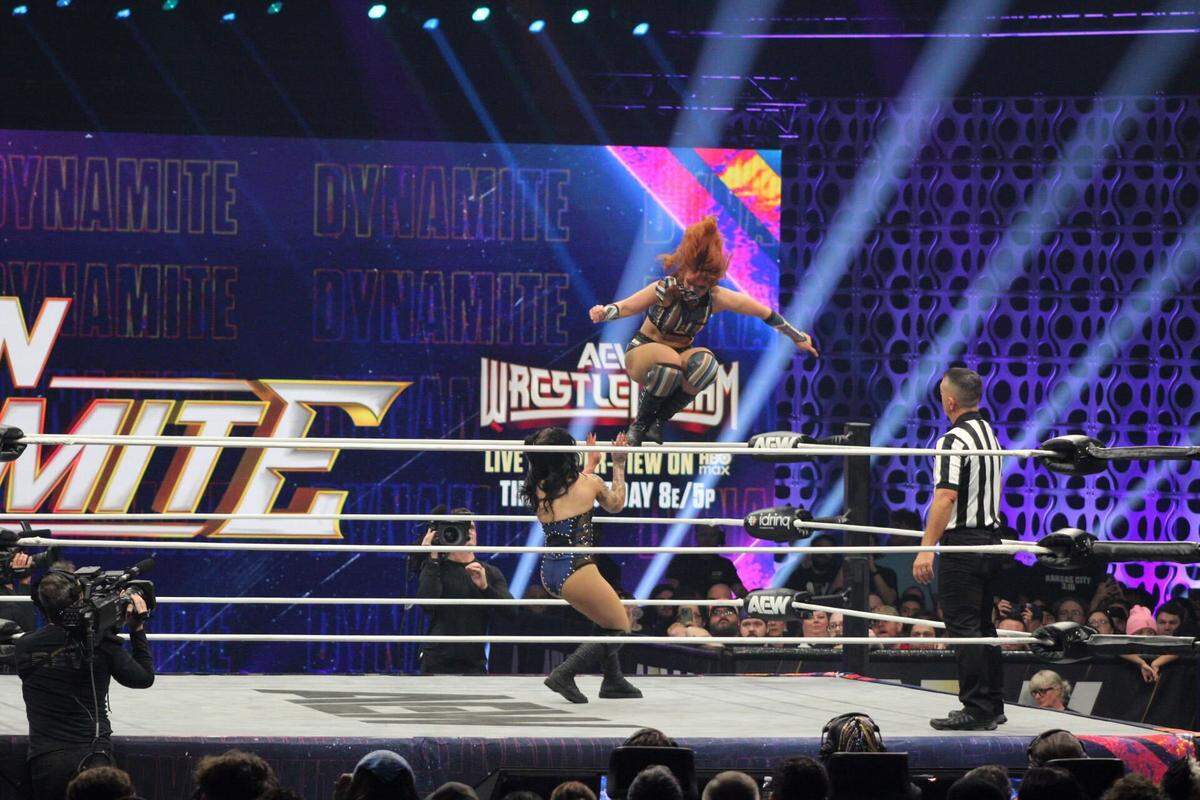 All Elite Wrestling pro wrestler Jamie Hayter lands a diving dropkick onto Skye Blue during their match on AEW Dynamite Wednesday, Oct. 15 at Cable Dahmer Arena in Independence.