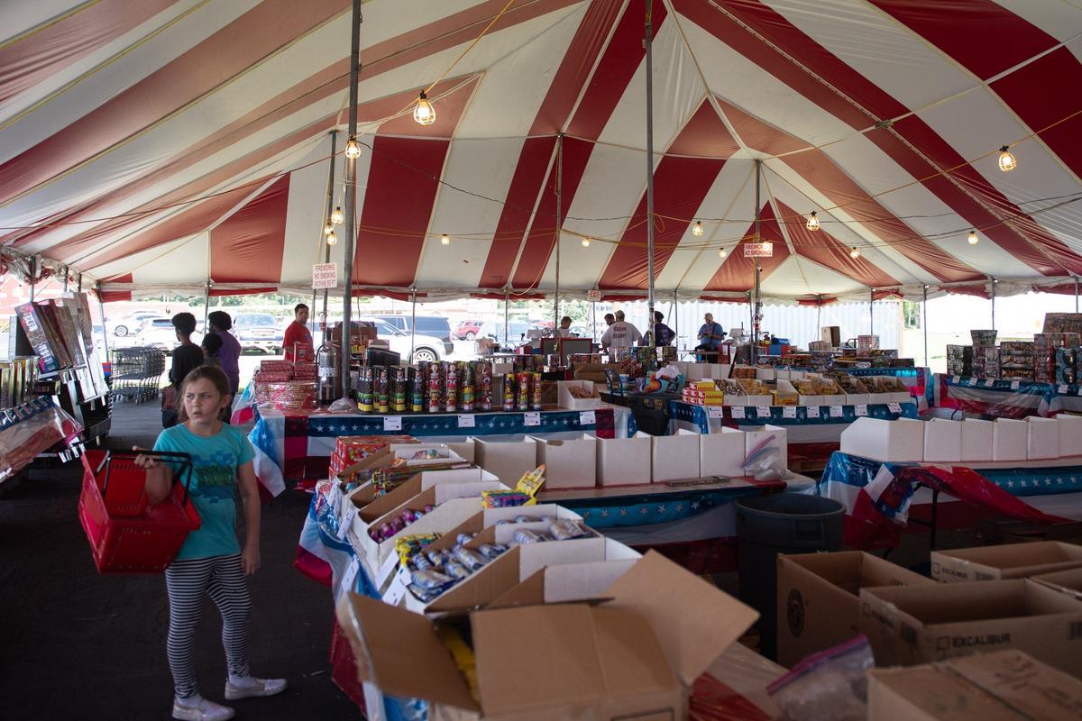 Customers browse at Honest John’s Fireworks on Tuesday in Riverside. Shops and tents throughout the Kansas City metro area offer a nearly unending selection of fireworks leading up to July 4, including many unique and outrageous varieties.