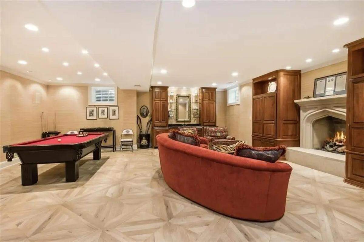 Look for a wet bar on the far wall of the basement at 434 W. 56th St., a Tudor-style home for sale.