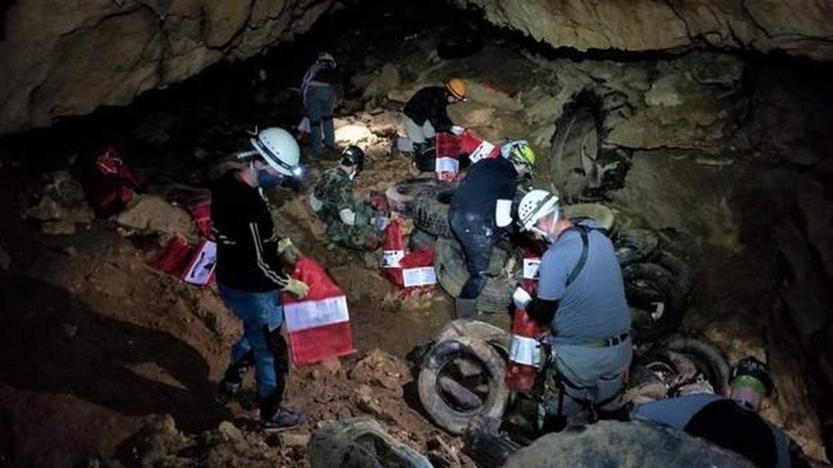 Officials say 3.5 tons of trash were removed from a Missouri sinkhole cave in one day.
