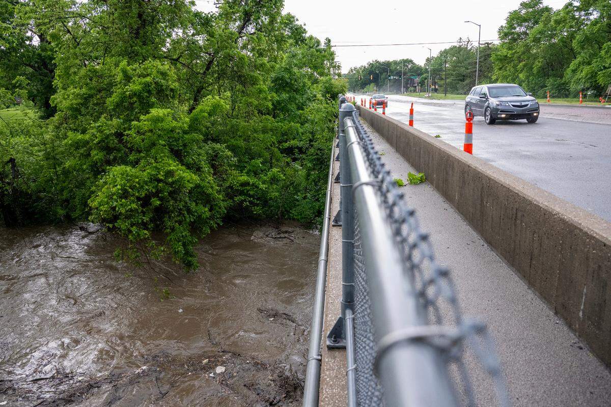 Indian Creek was bank-full at State Line Road near 103rd Street Monday, May 19, 2025, after strong storms dumped heavy rain on the Kansas City metro area.