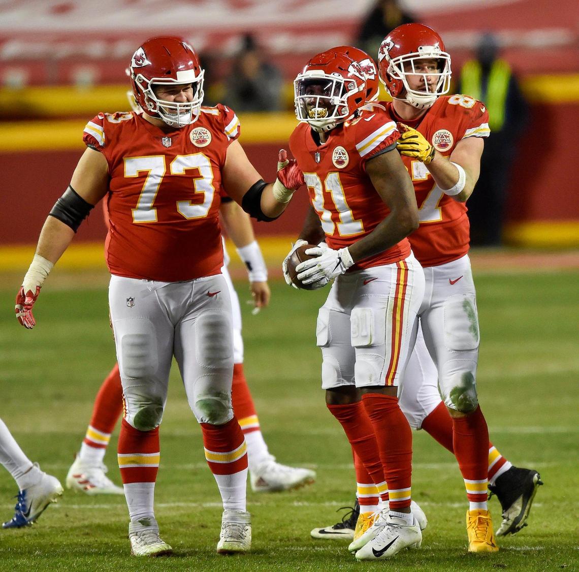 Kansas City Chiefs offensive guard Nick Allegretti (73) and tight end Travis Kelce celebrate after running back Darrel Williams (31) after Williams gained yards in the fourth quarter. Buffalo’s defense was penalized for unnecessary roughness on the play. The Kansas City Chiefs defeated the Buffalo Bills 38-24 to win the AFC Championship Game at Arrowhead Stadium Sunday Jan. 24, 2021, and will return to the Super Bowl.