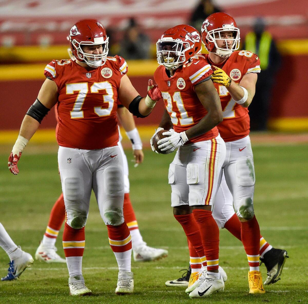 Kansas City Chiefs offensive guard Nick Allegretti (73) and tight end Travis Kelce celebrate after running back Darrel Williams (31) after Williams gained yards in the fourth quarter. Buffalo’s defense was penalized for unnecessary roughness on the play. The Kansas City Chiefs defeated the Buffalo Bills 38-24 to win the AFC Championship Game at Arrowhead Stadium Sunday Jan. 24, 2021, and will return to the Super Bowl.