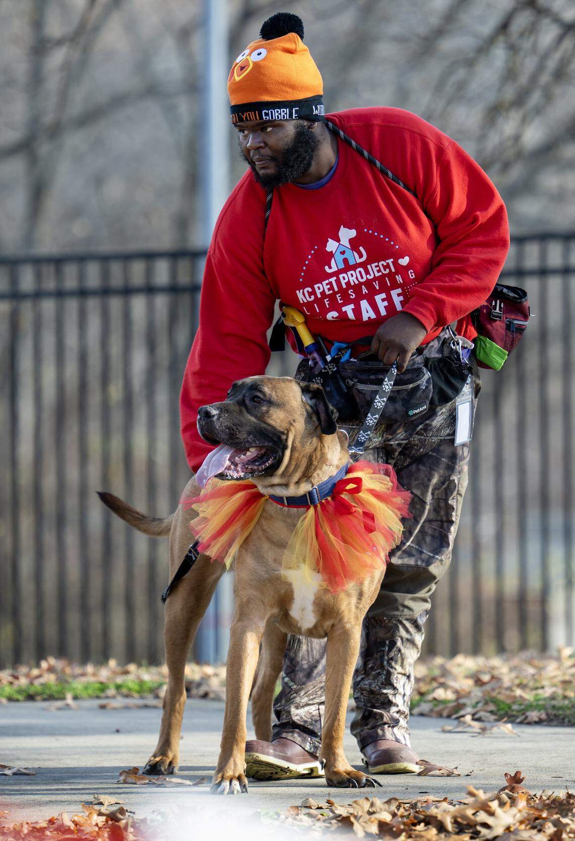 Darius Phillips of KC Pet Project brings Frank the Mastiff to the new “Barks & Rec” playground following the leash-cutting ceremony on Nov. 25, 2025, at the Swope Park campus.