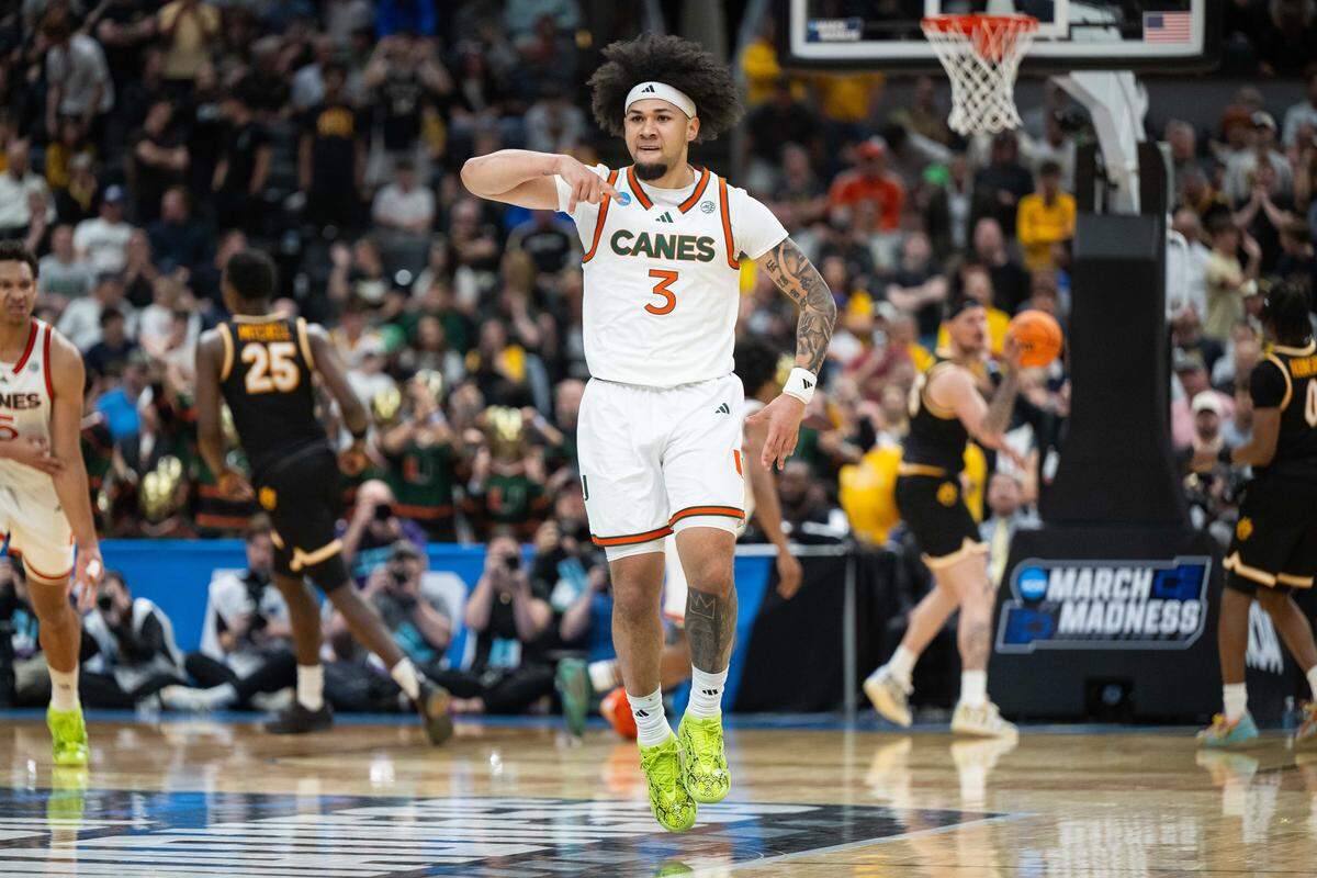 Miami Hurricanes guard Tre Donaldson (3) celebrates after a big three pointer later in the second half of the Tigers first-round NCAA Tournament matchup vs. the Miami Hurricanes at Enterprise Center in St. Louis on Friday, March 20, 2026.