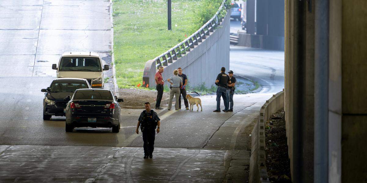 Police work the scene of a fatal shooting on westbound lanes of Interstate 670 near Broadway Boulevard on Wednesday, June 7, 2023, in Kansas City.