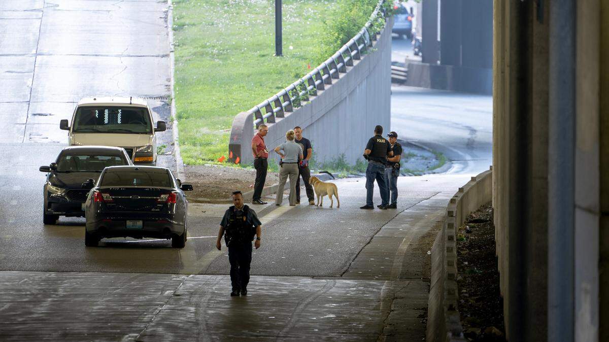 Police work the scene of a fatal shooting on westbound lanes of Interstate 670 near Broadway Boulevard on Wednesday, June 7, 2023, in Kansas City.