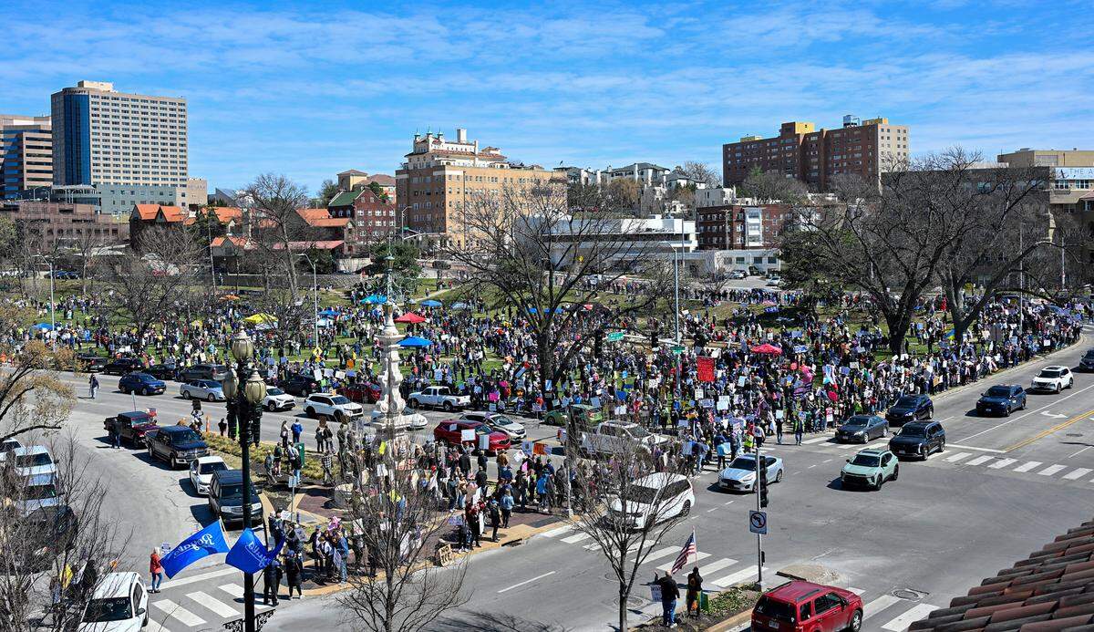 Protesters gathered in Mill Creek Park near the Country Club Plaza on Saturday, March 28, 2026, for a No Kings protest against the Trump administration. It's the third round of No Kings protests that have swept the nation over the past year.