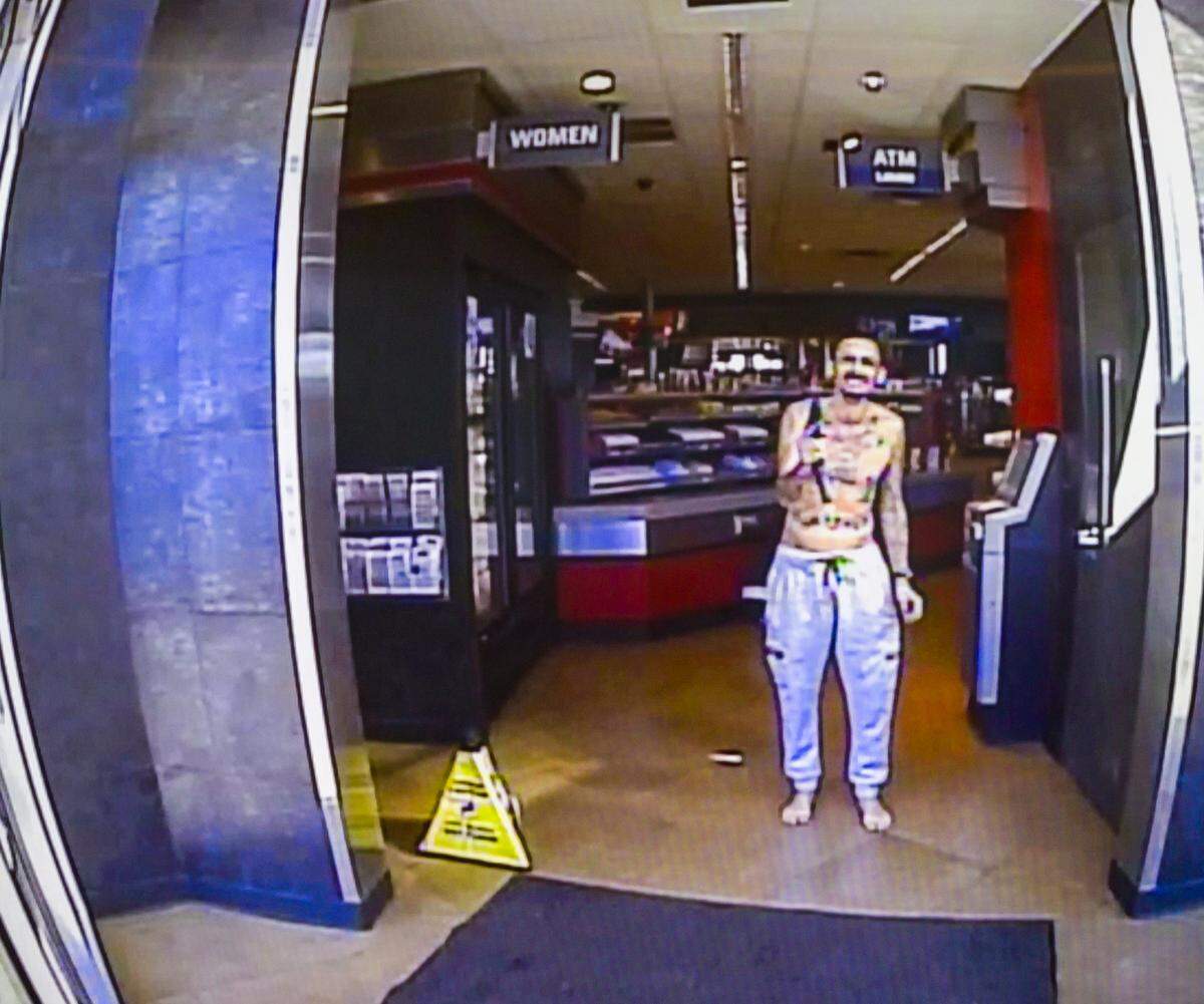 Body camera footage released by Johnson County District Attorney Steve Howe shows a man, identified as Brett Marshall Smiley, who reportedly pointed a gun at police before he was fatally shot.
