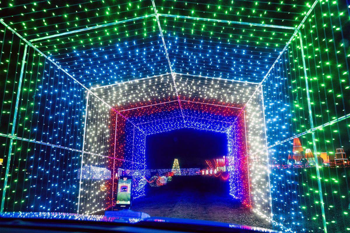 A lighted tunnel featuring thousands of lights awaits visitors at North Pole Acres, 1010 NW 1st St., in Oak Grove on Wednesday, Dec. 10. The animated drive-through holiday display costs $20 per car, $40 per commercial vehicle. 