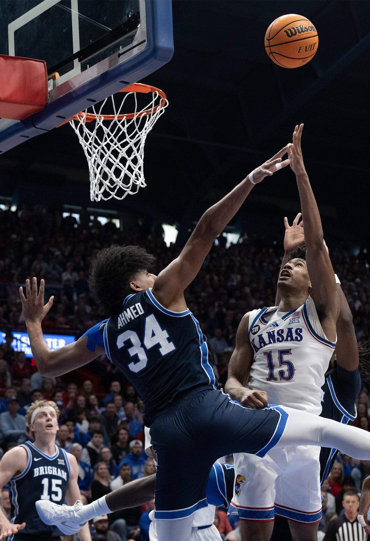 Kansas Jayhawks forward Bryson Tiller (15) goes up for two as BYU Cougars center Abdullah Ahmed (34) defends in the first half at Allen Fieldhouse on Saturday, Jan. 31, 2026, in Lawrence.