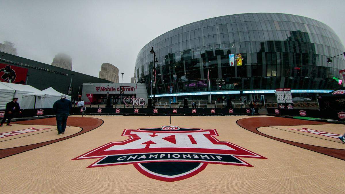 The Big 12 logo at the center of the fan experience court outside the Big 12 Tournament at T-Mobile Center.