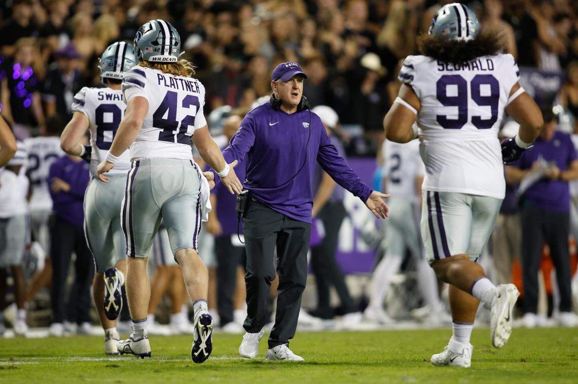 Kansas State Wildcats head coach Chris Klieman congratulates his players as the leave the field in the second quarter against the TCU Horned Frogs at Amon G. Carter Stadium on Oct. 22, 2022.