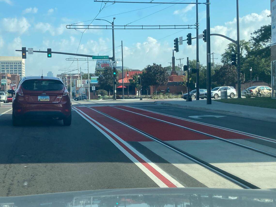 The triple solid line, with two white lines with a red line in the middle, means no crossing.