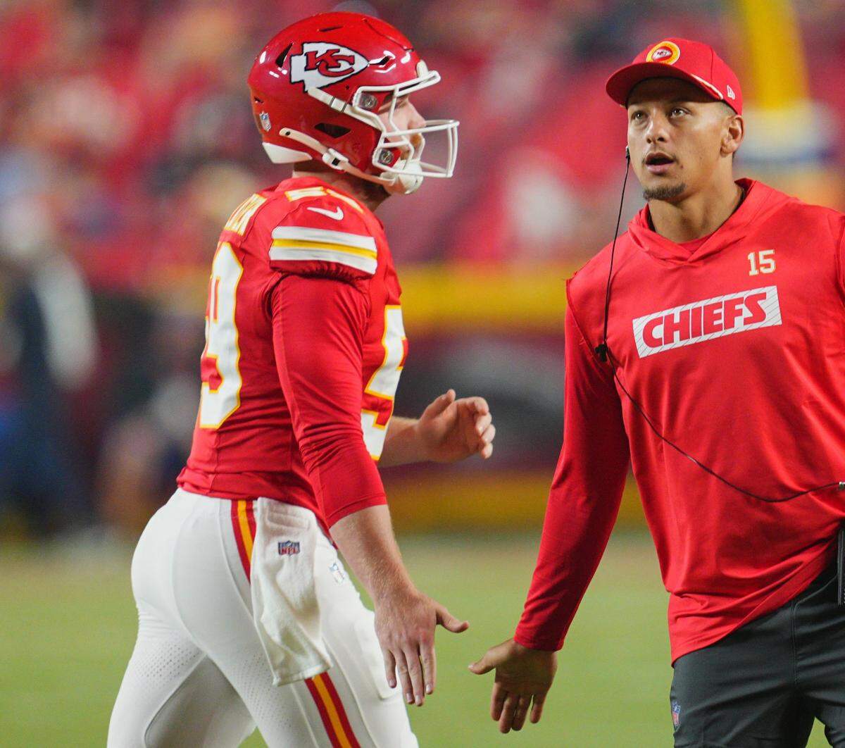 Kansas City Chiefs long-snapper Randen Plattner, left, gets an atta-boy from quarterback Patrick Mahomes during Thursday night’s game against the Chicago Bears at GEHA Field at Arrowhead Stadium.