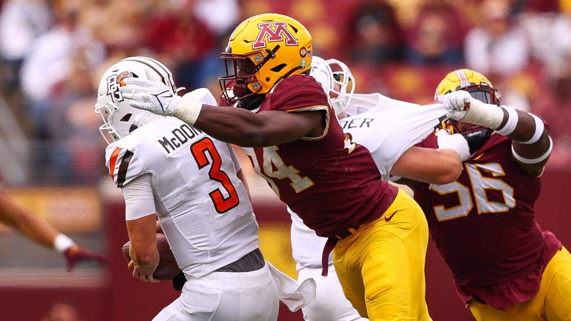 Former Minnesota Gophers defensive lineman Austin Booker (94) sacks Bowling Green Falcons quarterback Matt McDonald (3) during the third quarter at Huntington Bank Stadium on Sept. 25, 2021.