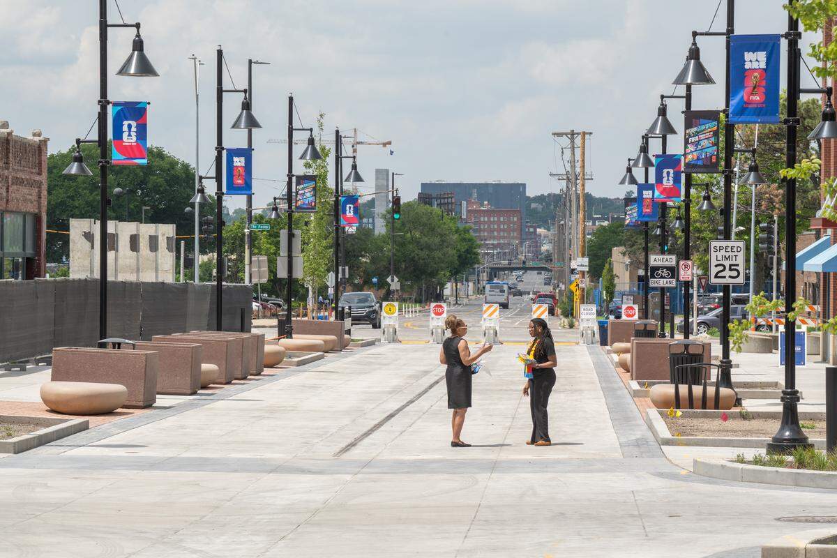 Two women stand on the newly opened pedestrian mall in the 18th & Vine Jazz District on Wednesday, May 27, in Kansas City.