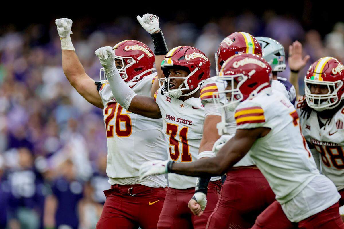Iowa State players celebrate a defensive stop during the Aer Lingus Classic between Iowa State and Kansas State at Aviva Stadium in Dublin on Aug. 23, 2025.