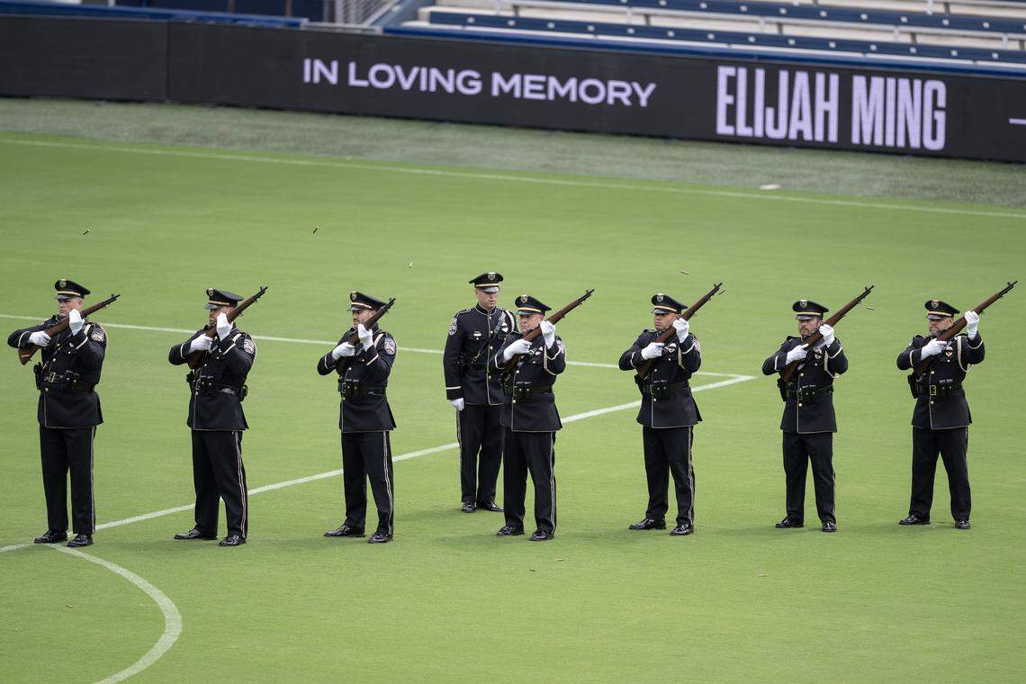 A 21-gun salute is fired in honor of Deputy Elijah Ming following his funeral service Monday, Aug. 11, 2025, at Children's Mercy Park in Kansas City, Kansas.